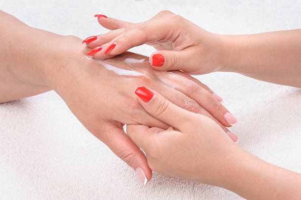 istock beauty salon, hands massage with moisturizing cream 499619681