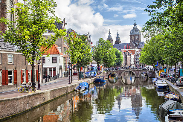 istock Canal and St. Nicolas Church in Amsterdam 499620369