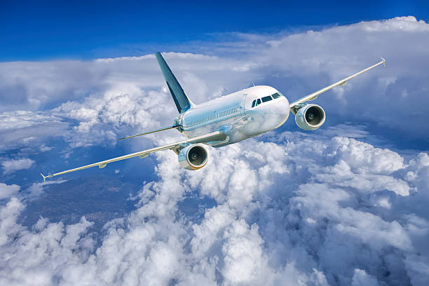 istock Aircraft in the blue sky above white clouds 499620456