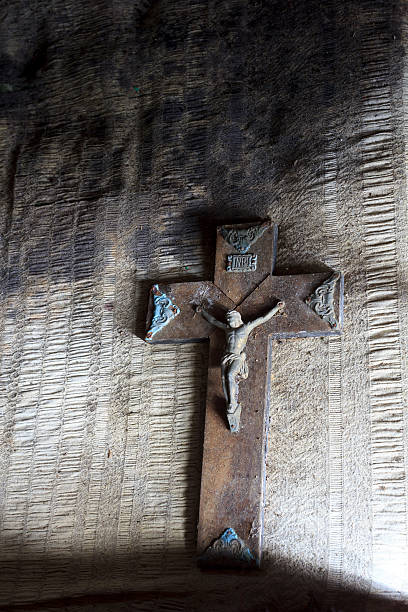 istock cross of christ lying on a rotten sheet 499621134