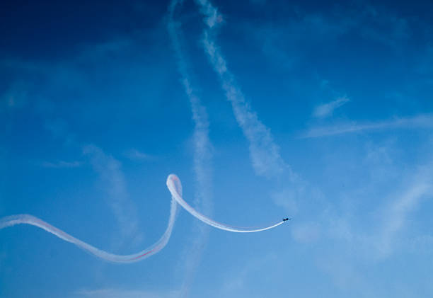 istock Low angle view of an airplane performing airshow 499622301