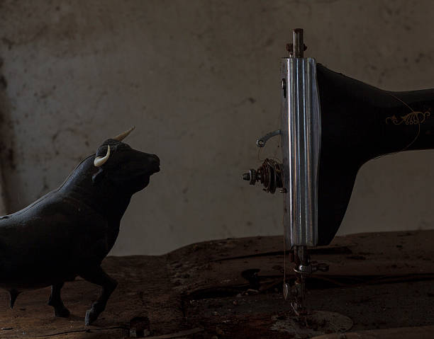 figure of a bull with a sewing machine