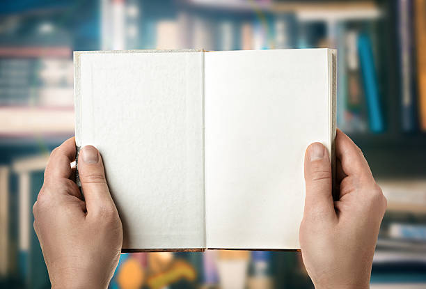 istock Reading a book in the library. First-person view 499624042