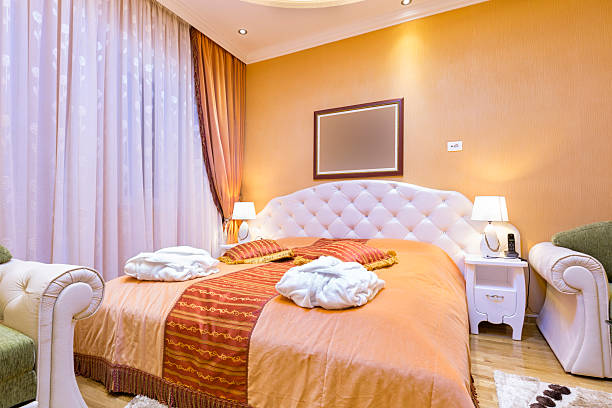 istock Elegant hotel bedroom interior 499625468