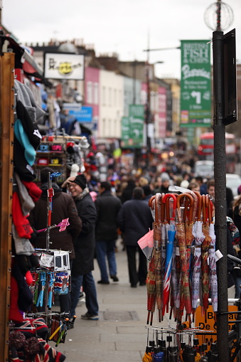 Camden High Street, London, United Kingdom, November 28, 2015: Merchandise on busy street with de-focused background. 