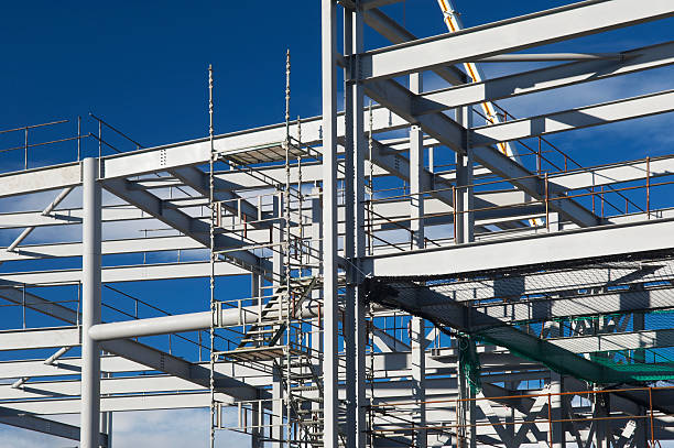 Retail or business construction Metal construction frame on a business development site near Aberdeen, Scotland, UK. Site is being developed for retail, business and hotels. girder photos stock pictures, royalty-free photos & images