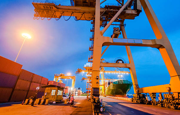 istock Cargo ship in the harbor at sunset . 499629854