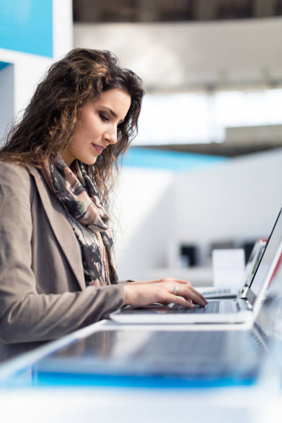 istock Woman new choosing laptop 499630496