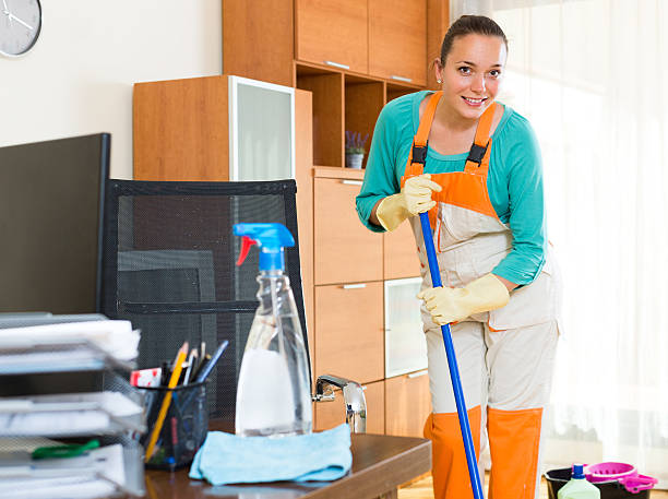istock Woman cleaning at the office 499630590