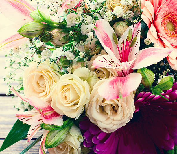 istock Flowers rose on wooden surface. 499630846