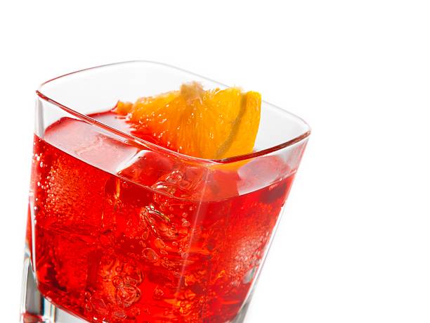 istock red cocktail with orange slice isolated on white background 499631730