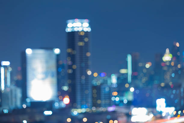 istock Blurred bokeh lights city office building at night 499632460