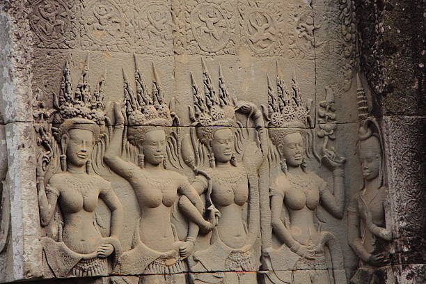 Apsara Dancers Stone Carving. stock photo