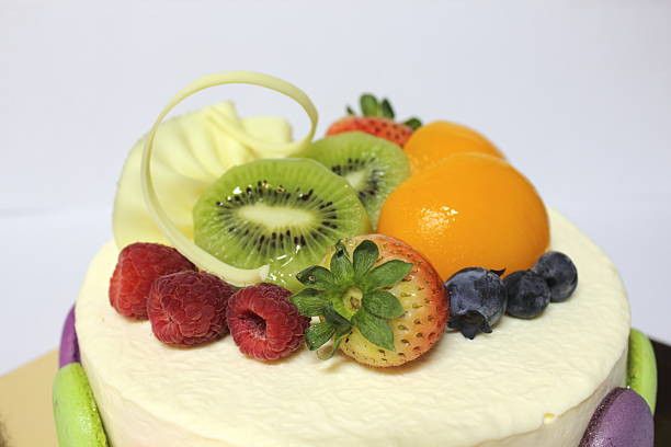 istock mousse cake and topped with fresh fruit. 499640797