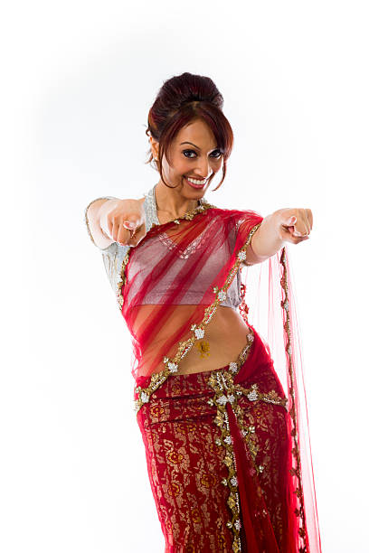 istock Smiling young Indian woman pointing towards camera from both hands 499642705