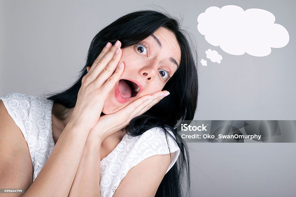 Woman in Shock Woman with shocked facial expression - Thought bubbles above her head 20-24 Years Stock Photo