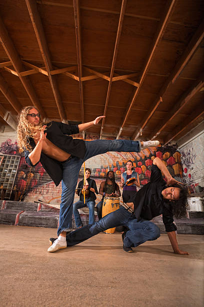 istock Male Capoeiristas Kicking 499645039