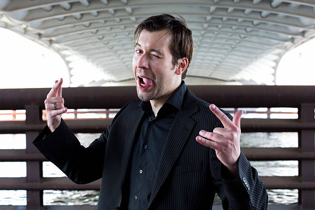 istock businessman makes funny faces 499645333