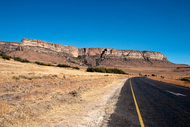 istock Curved Rural Road with Panoramic View of Mountains 499646533