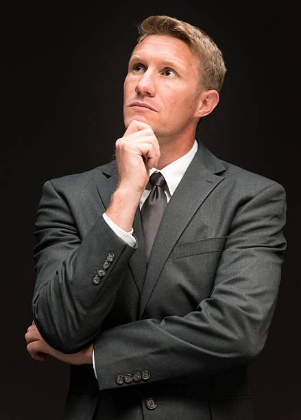 istock Businessman looking away and thinking 499648036