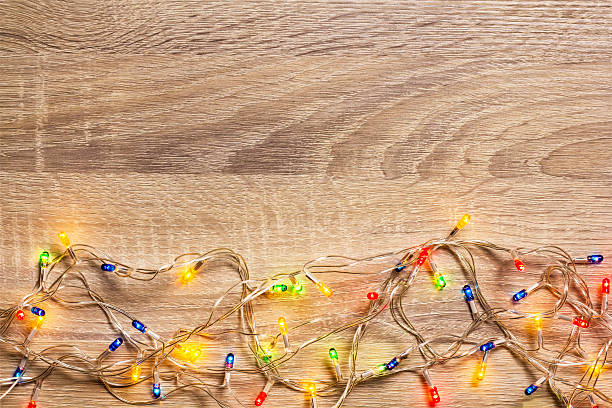istock Christmas Light on Wood Background 499648404