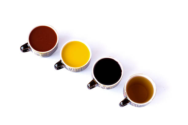 istock Four different juices in ceramic cups isolated on white 499649124