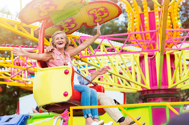 istock Senior couple in amusement park 499649130