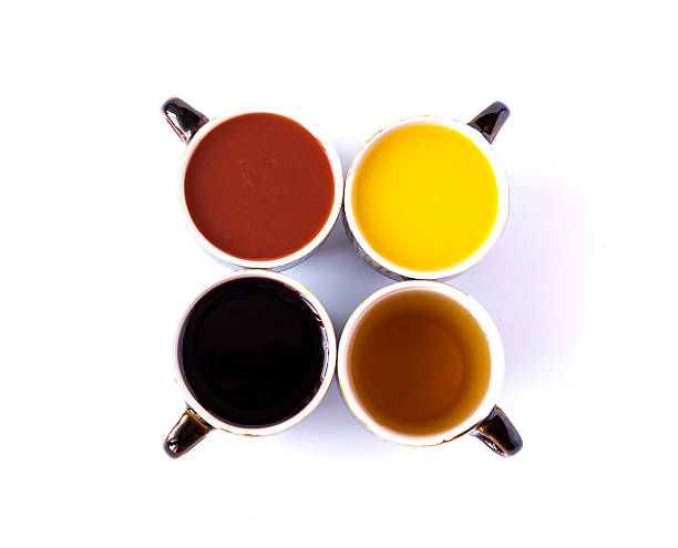 istock Four different juices in ceramic cups isolated on white 499649222