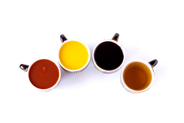 istock Four different juices in ceramic cups isolated on white 499649322