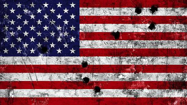 USA flag painted on metal with bullet holes stock photo