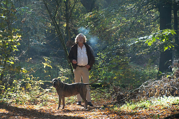 istock Men smoking a cigarette  in the forest 499650860