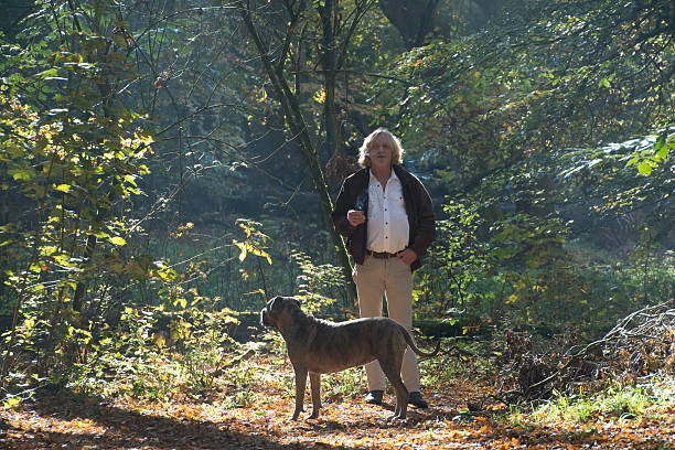 istock Men smoking a cigarette  in the forest 499650956