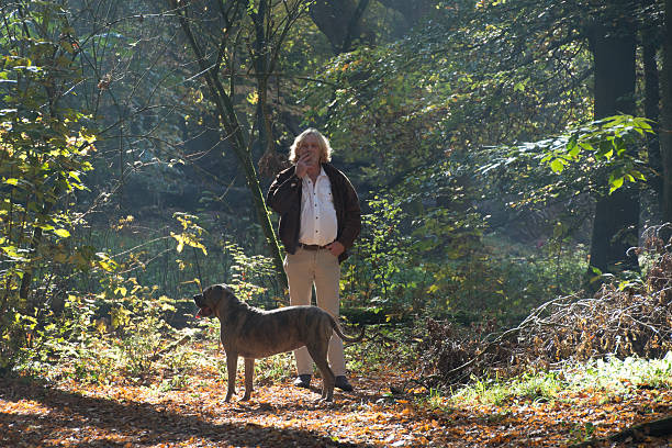 istock Men smoking a cigarette  in the forest 499651038
