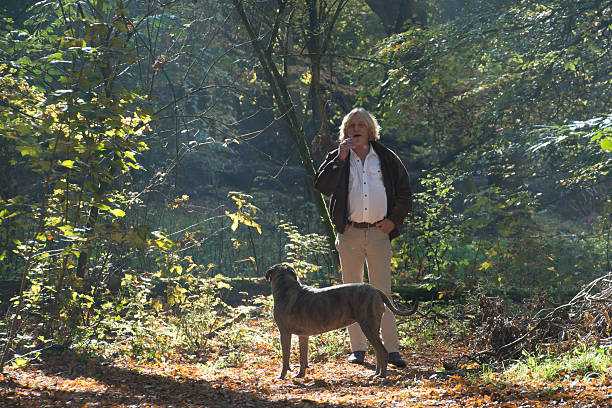 Men smoking a cigarette  in the forest