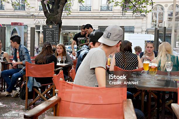 Young People At The Outdoor Cafe Having Drinks Stock Photo - Download Image Now - France, Adolescence, Meal