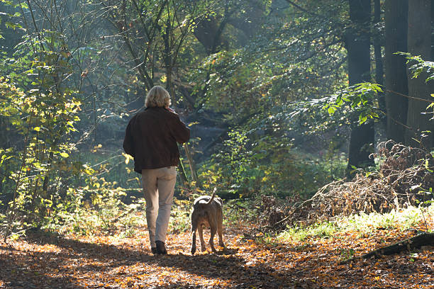Men smoking a cigarette  in the forest