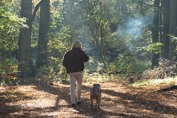 istock Men smoking a cigarette  in the forest 499651526