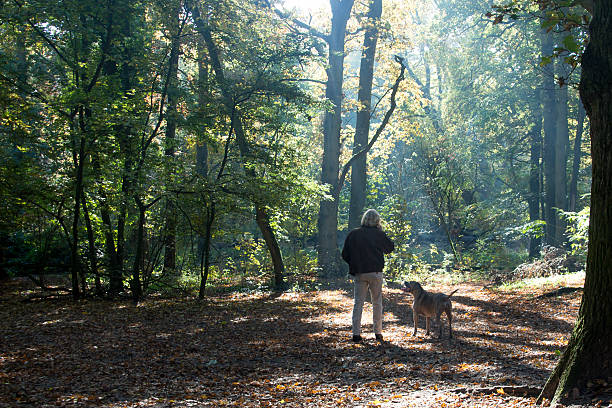istock Men smoking a cigarette  in the forest 499651654