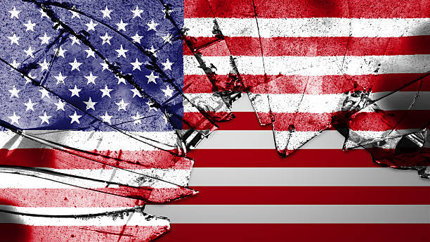 USA flag painted on broken glass stock photo