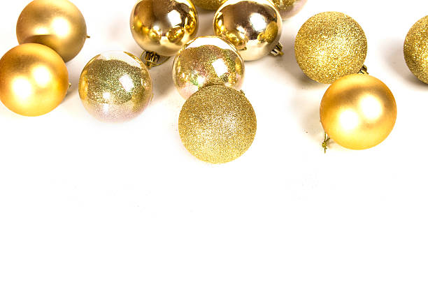 istock Gold Christmas balls on a white table 499655404