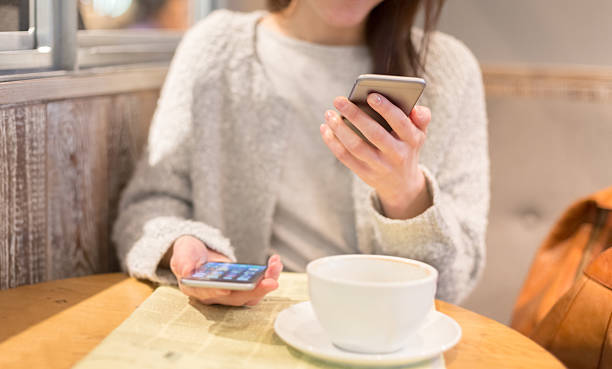 istock Business person at coffee break using smartphones 499656638