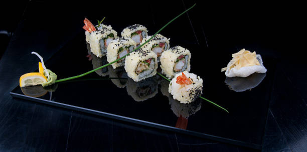 istock Uramaki sushi on a black plate 499656740