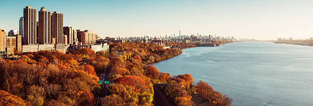 New York City Skyline Panorama over Hudson River at Sunset New York City Skyline Panorama over The Hudson River at Sunset hudson river stock pictures, royalty-free photos & images