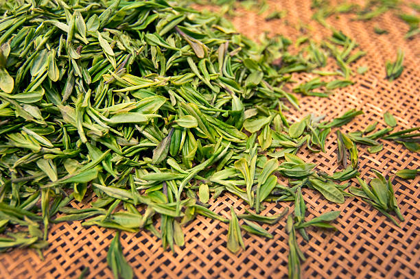 istock Green fresh tea leaves in a basket 499659529