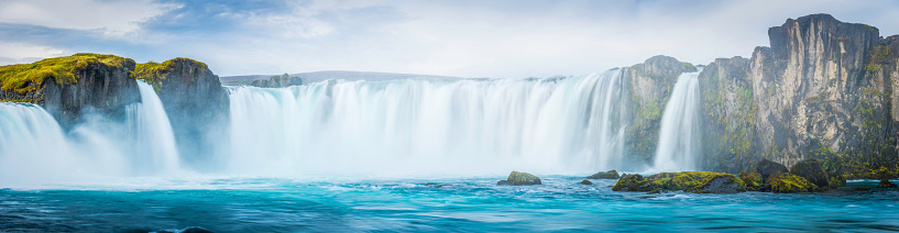 The turquoise waters of the Skjálfandafljót river cascading over the spectacular Godafoss waterfalls in the Arctic north of Iceland. ProPhoto RGB profile for maximum color fidelity and gamut.