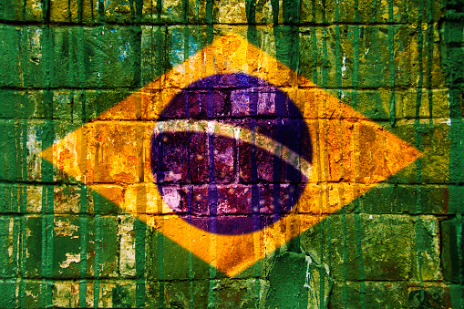 Brazilian flag, brick wall texture