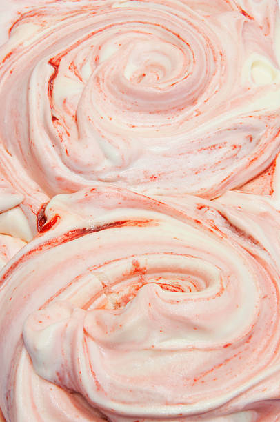 Close up of swirls of homemade strawberry ice cream in an specialist ice cream shop - Aberdeenshire, Scotland, UK.