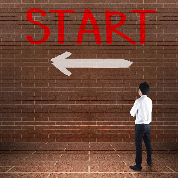 istock Businessman looking at arrows 499661073