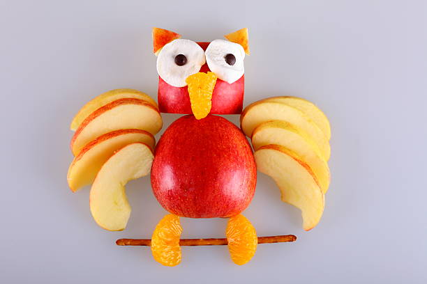 Apple owl From an apple carved owl - cut out carving fruit stock pictures, royalty-free photos & images