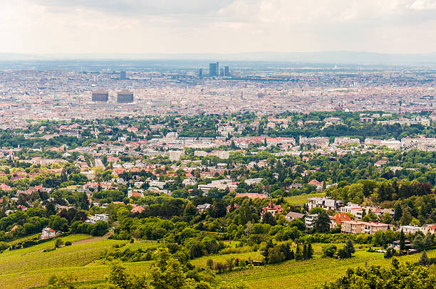 Overlooking the city and street view of Vienna from St. Stephen's Cathedral in Vienna, Austria, the photo shows Vienna's famous churches and castles, which are one of the favorite tourist attractions for tourists from all over the world. The photo was taken on August 4, 2024, at the observation deck of the south tower of St. Stephen's Cathedral in Vienna.